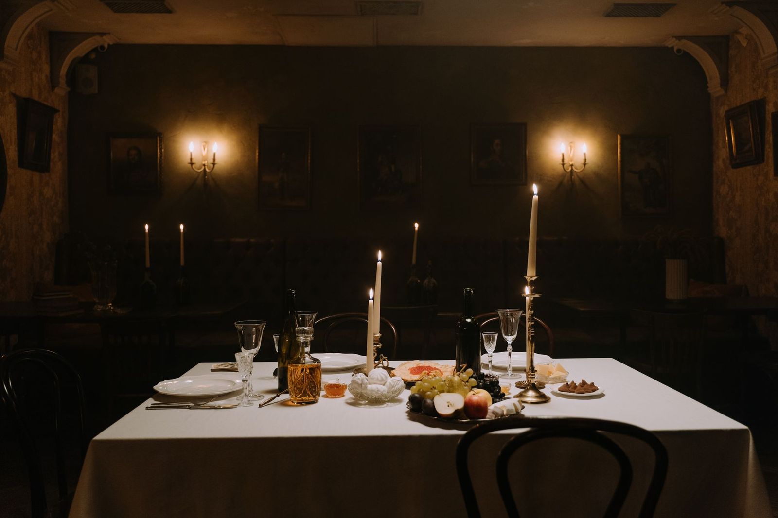 A candlelit table set with an empty place, the silent dumb supper shared with the dead